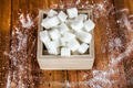 Sugar Cubes in Square Shaped Bowl with Unrefined Sugar spill over in Wooden Background - PhotoDune Item for Sale
