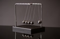 Newton cradle representing momentum - PhotoDune Item for Sale