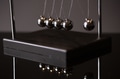 Newton cradle representing momentum - PhotoDune Item for Sale