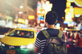 Young Asian male travel backpacker walking on street - PhotoDune Item for Sale