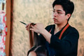 Young male hairdresser cutting client hair - PhotoDune Item for Sale