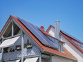 home with solar energy green plants and sunny blue sky - PhotoDune Item for Sale