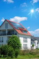 home with solar energy green plants and sunny blue sky - PhotoDune Item for Sale