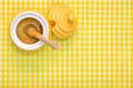 Honey pot and dipper on yellow background with copy space. - PhotoDune Item for Sale