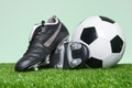 Football or Soccer boots and ball on grass - PhotoDune Item for Sale