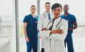 Black female standing in front of team - PhotoDune Item for Sale