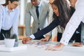 Diverse businesspeople standing in a boardroom solving a jigsaw puzzle - PhotoDune Item for Sale