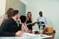 Diverse group of designers having a meeting in an office - PhotoDune Item for Sale