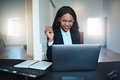 Young African American businesswoman smiling while working on a laptop - PhotoDune Item for Sale