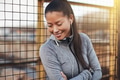 Sporty young Asian woman standing outside in the city - PhotoDune Item for Sale