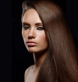Studio portrait of young woman with long brown hair - PhotoDune Item for Sale