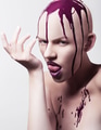 Hairless woman licking hand covered with paint - PhotoDune Item for Sale