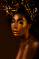 Woman's face painted gold - PhotoDune Item for Sale