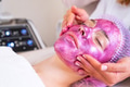 Cosmetologist making massage the skin of the forehead. - PhotoDune Item for Sale