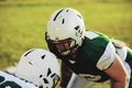 Two football players lining up for defensive drills during practice - PhotoDune Item for Sale