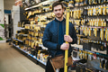 Young carpenter holding a builders level - PhotoDune Item for Sale