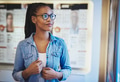 Satisfied young woman wearing eyeglasses at store - PhotoDune Item for Sale