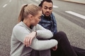 Diverse young couple taking a break from an outdoor run - PhotoDune Item for Sale