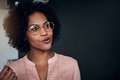 Smiling African businesswoman talking to a colleague in an office - PhotoDune Item for Sale