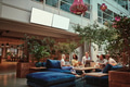 Smiling businesspeople relaxing in the lounge area of an office - PhotoDune Item for Sale