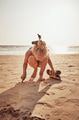 Little girl playing in the sand during a beach vacation - PhotoDune Item for Sale