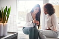 Two young woman reading an sms on a mobile - PhotoDune Item for Sale