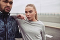 Sporty young couple catching their breath while out jogging - PhotoDune Item for Sale