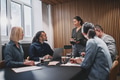 Smiling businesswoman meeting with colleageus in an office boardroom - PhotoDune Item for Sale