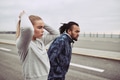 Young couple in sportswear preparing for a run together - PhotoDune Item for Sale