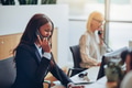 African American businesswoman talking on a telephone in an office - PhotoDune Item for Sale