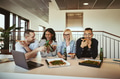 Laughing group of coworkers having pizza and beer after work - PhotoDune Item for Sale