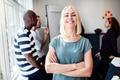 Confident young designer and colleagues working together in an office - PhotoDune Item for Sale