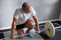 Mature man preparing to lift weights at the gym - PhotoDune Item for Sale