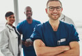 Young doctor in front of team - PhotoDune Item for Sale