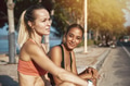 Two fit friends sitting in the sun before working out - PhotoDune Item for Sale