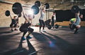 Adults lifting large barbells in fitness class - PhotoDune Item for Sale