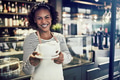 Young cafe barista holding up a fresh cup of coffee - PhotoDune Item for Sale