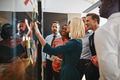 Young businesswoman and her team brainstorming with sticky notes - PhotoDune Item for Sale