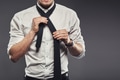 Businessman dressing tying his necktie - PhotoDune Item for Sale