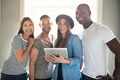 Smiling confident informal young businesspeople - PhotoDune Item for Sale