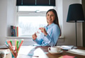 Smiling woman at desk in home office - PhotoDune Item for Sale