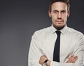 Stern grim businessman with folded arms - PhotoDune Item for Sale