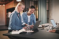 Smiling businesswomen working together on a laptop in an office - PhotoDune Item for Sale