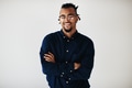 Confident young African American entrepreneur standing against a white background - PhotoDune Item for Sale