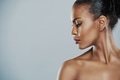 Woman looking sideways over gray background - PhotoDune Item for Sale