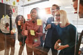 Laughing businesspeople having a brainstorming session in an office - PhotoDune Item for Sale