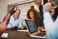 Businesspeople laughing together during a boardroom meeting - PhotoDune Item for Sale