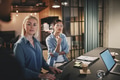 Businesswomen talking with coworkers during an office meeting - PhotoDune Item for Sale
