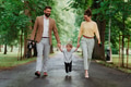 Young family with little son on walk after work. - PhotoDune Item for Sale
