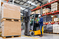 Forklift driver talking with manager in modern industrial factory. Woman warehouse worker discussing - PhotoDune Item for Sale